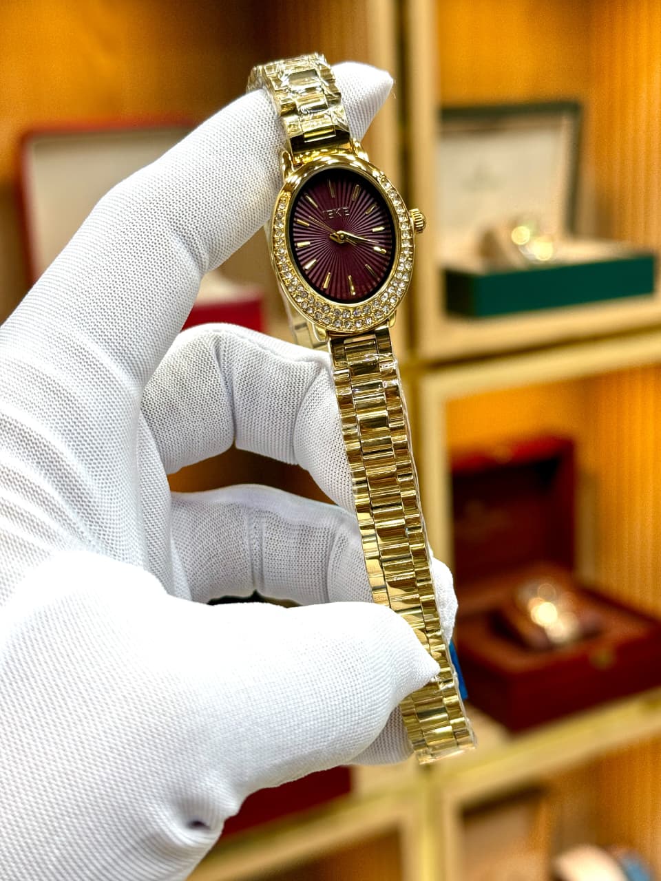 Luxury Women’s Gold & Burgundy Oval Dial Watch